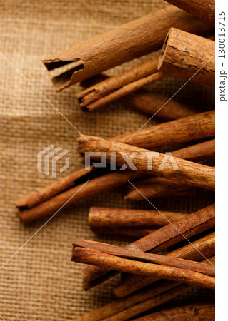 Cinnamon sticks dried tree bark spice on rustic background. 130013715