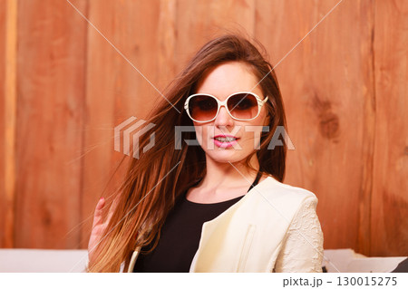 Young fashionable woman posing during sunny day. Young fashionable woman posing during sunny day. 130015275