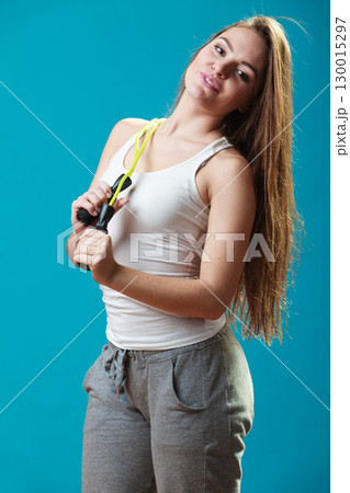 Fit woman with jumping rope 130015297