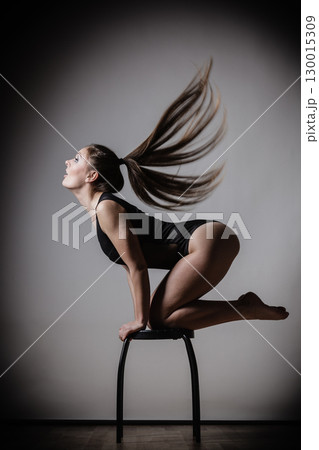 Atletic woman fit slim body posing 130015309