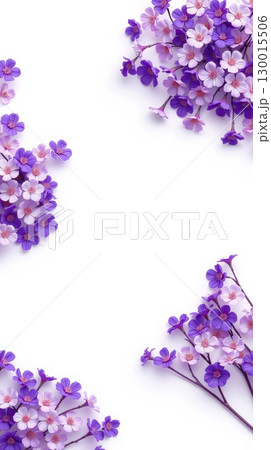 Purple and pink flowers creating a border on white background 130015506