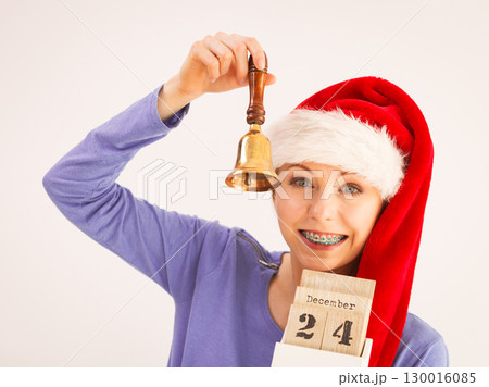 Woman and christmas calendar with bell Woman and christmas calendar with bell 130016085