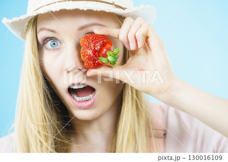 Young woman with fresh strawberries Young woman with fresh strawberries 130016109