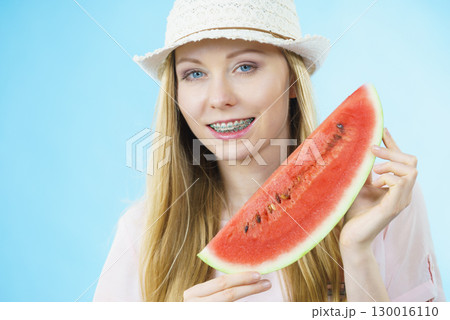 woman holding watermelon fruit 130016110
