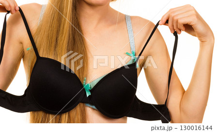 Woman choosing bra to wear Woman choosing bra to wear 130016144