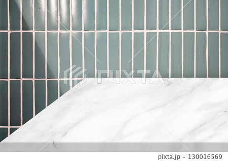 Marble Countertop and Teal Tile Background. 130016569