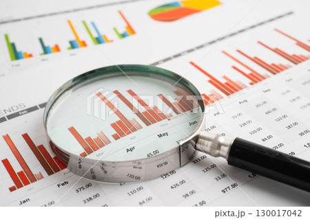 Magnifying glass on charts graphs paper. Financial development, Banking Account, Statistic, Investment Analytic research data economy. 130017042