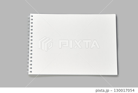 Blank spiral notebook on gray background with open white pages for sketching 130017054