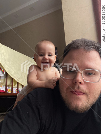 Playful Bonding Time with Baby and Dad 130018580