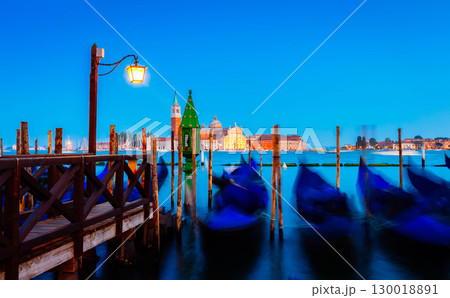 Gondolas floating in the Grand Canal at night, Venice Gondolas floating in the Grand Canal at night, Venice 130018891
