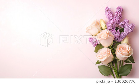 Elegant bouquet of pink roses and purple lilacs on soft pastel copy space background 130020770