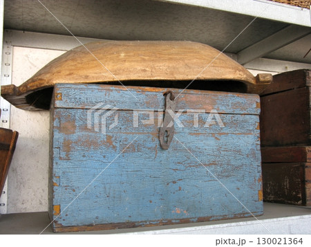 Weathered Blue Wooden Chest with Curved Wooden Lid on Rustic Shelf Storage Weathered Blue Wooden Chest with Curved Wooden Lid on Rustic Shelf Storage 130021364