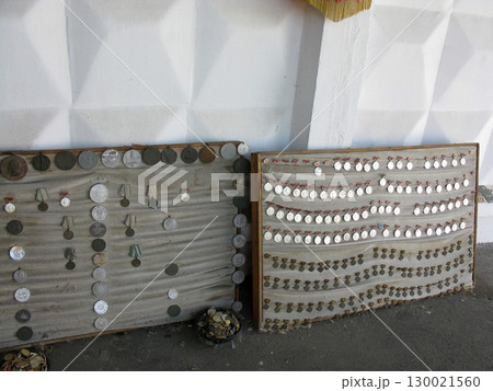 Vintage Medal Display Boards with Ribbons Showcasing a Collection of Awards 130021560