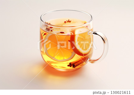 Glass mug of hot citrus tea with lemon slices and cinnamon sticks Glass mug of hot citrus tea with lemon slices and cinnamon sticks 130021611