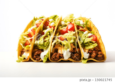 Delicious beef tacos with lettuce, tomato, and cheese 130021745