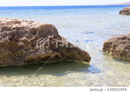 Massive Coastal Rocks in Shallow Water with a Distant Horizon View Massive Coastal Rocks in Shallow Water with a Distant Horizon View 130021950