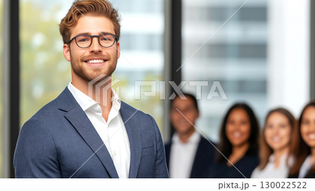 Young man male leader in business meeting with diverse team in office 130022522