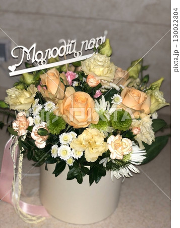 Elegant Floral Arrangement with Peach Roses and Daisies in a White Vase Elegant Floral Arrangement with Peach Roses and Daisies in a White Vase 130022804
