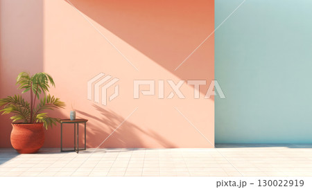 Minimalist patio with coral and aqua walls, potted plant, and table 130022919