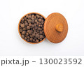 Bowl of black round pepper on white background, top view. 130023592