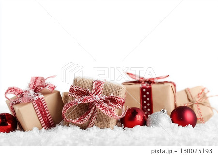 Christmas gift boxes and decor in snow. Isolated on white background Christmas gift boxes and decor in snow. Isolated on white background 130025193