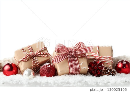 Christmas gift boxes and decor in snow. Isolated on white background Christmas gift boxes and decor in snow. Isolated on white background 130025196