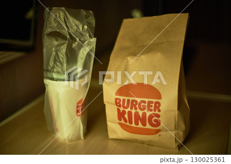 Burger King takeout bag and drink cup on a table in Busan, South Korea 130025361
