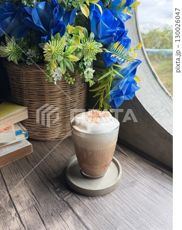 Delicious Cappuccino with Perfect Foam and Cocoa Dusting in a Minimalist White Cup Delicious Cappuccino with Perfect Foam and Cocoa Dusting in a Minimalist White Cup 130026047