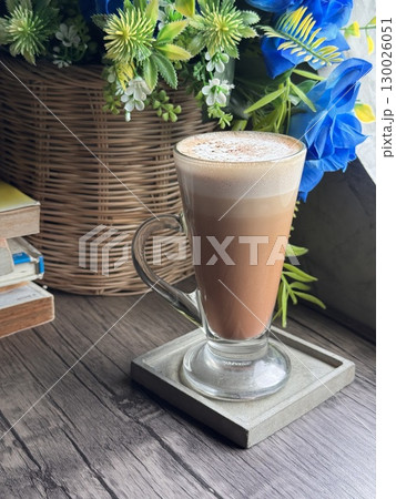 Delicious Cappuccino with Perfect Foam and Cocoa Dusting in a Minimalist White Cup 130026051