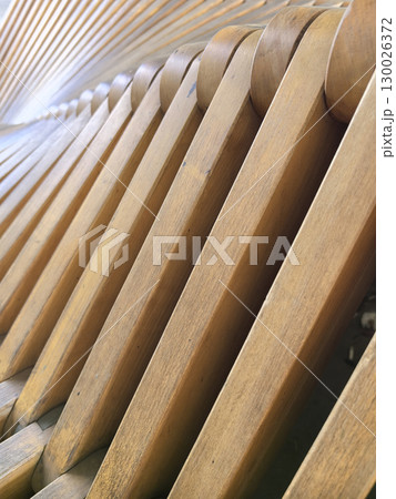 Organic lines of a wooden structure create soothing patterns in daylight Organic lines of a wooden structure create soothing patterns in daylight 130026372