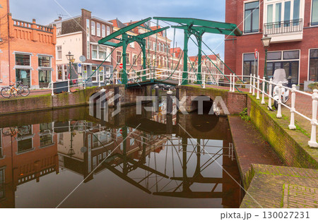 Drawbridge over canal in Leiden Netherlands at dawn 130027231
