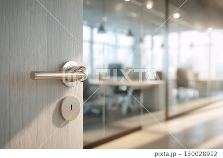 Doorknob. Metal door handle lock and latch of brass on veneer doors. Door wooden half opening through interior bedroom background, selective focus. Modern trends in interior design. Close-up. 130028912