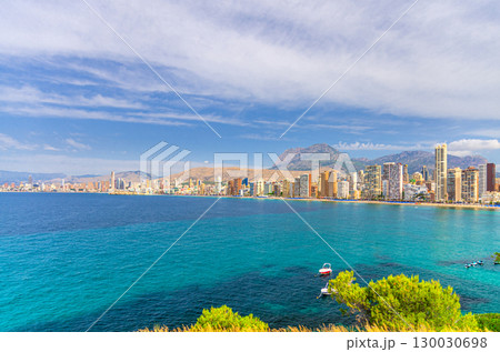 Panoramic view of Old town Benidorm city centre coastline with skyscraper buildings, beach on Costa Blanca coast Mediterranean Sea water and Puig Campana mountain Sierra Cortina in summer day, Spain Panoramic view of Old town Benidorm city centre coastline with skyscraper buildings, beach on Costa Blanca coast Mediterranean Sea water and Puig Campana mountain Sierra Cortina in summer day, Spain 130030698