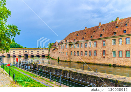 St John's Commandery Commanderie Saint Jean and Barrage Vauban Dam Great Lock bridge, weir and defensive work on River Ill in old town Strasbourg city historic centre, Alsace Grand Est region, France 130030915