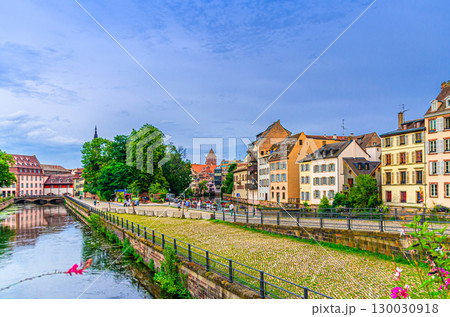 River Ill canal, Quai du Woerthel promenade embankment and colorful houses medieval buildings in The Petite France Quarter, old town Strasbourg city historic Centre, Alsace Grand Est region, France 130030918