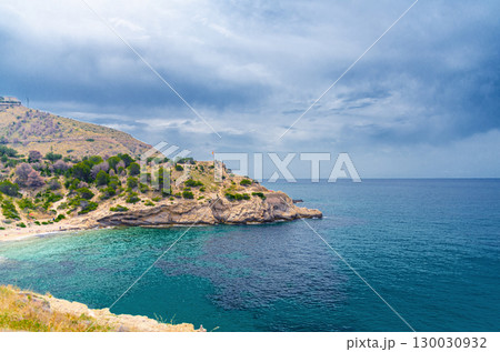 Cala Almadraba Cove beach in Benidorm bay Mediterranean Sea azure turquoise water, Costa Blanca coastline coast in Serra Gelada natural park in summer day, Valencian Community, Spain Cala Almadraba Cove beach in Benidorm bay Mediterranean Sea azure turquoise water, Costa Blanca coastline coast in Serra Gelada natural park in summer day, Valencian Community, Spain 130030932