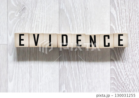 The concept of business and finance. There are wooden evidence blocks on the table. 130031255