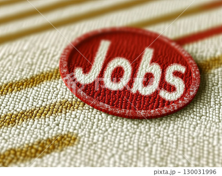 Jobs badge on textured fabric background representing employment opportunities 130031996