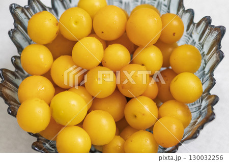 Yellow cherry plum in the decorative vase Yellow cherry plum in the decorative vase 130032256