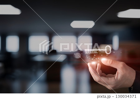 Holding the key to success in a modern workspace. Holding the key to success in a modern workspace. 130034371