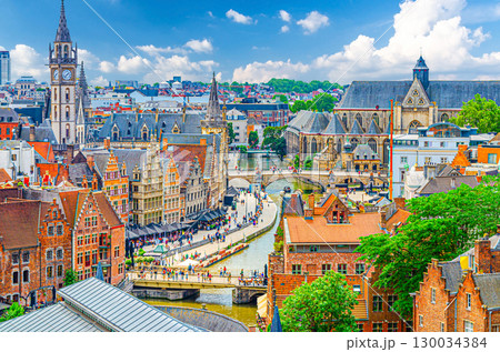 Ghent cityscape, aerial panoramic view of Ghent historic city centre with old traditional buildings on Lys Leie river embankment Graslei Grass Quay, panorama of Gent old town, Flemish region, Belgium Ghent cityscape, aerial panoramic view of Ghent historic city centre with old traditional buildings on Lys Leie river embankment Graslei Grass Quay, panorama of Gent old town, Flemish region, Belgium 130034384