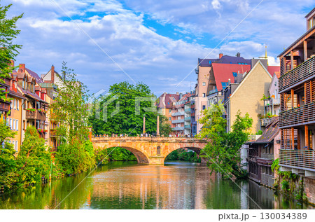 Junk Bridge Trodelbrucke with Obelisk mit Friedenstaube dove of peace, Medieval buildings on Pegnitz river bank in Old town Nuremberg city center, Middle Franconia region, Bavaria state, Germany 130034389