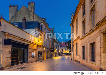 Rue Forges pedestrian street in Dijon city historical centre with stores, shops and old houses medieval buildings, Dijon old town on twilight dusk evening view, Bourgogne-Franche-Comte region, France 130034404
