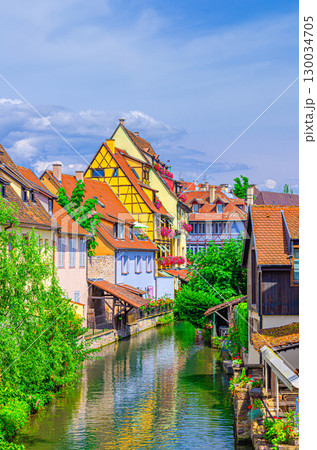Colmar cityscape, Little Venice la Petite Venise area with old medieval houses on bank of river Lauch canals in old town Colmar city historic centre Krutenau quarter, Alsace Grand Est region, France 130034705