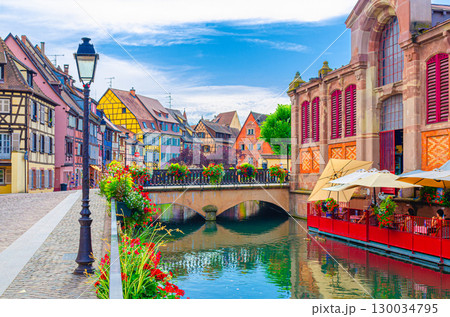Little Venice la Petite Venise in old town Colmar city historic centre with old colorful houses and Covered market building on Quai Poissonnerie of river Lauch canal, Alsace Grand Est region, France 130034795