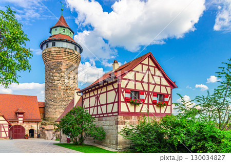 Nuremberg Castle Nurnberger Burg Imperial castle Kaiserburg courtyard with Sinwell Tower and Tiefer Brunnen Deep Well half-timbered building in old town Nuremberg city historical center, Germany 130034827