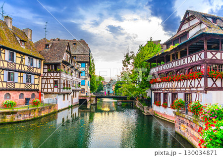 The Petite France Quarter, old houses medieval buildings, Maison des Tanneurs and Faisan bridge across River Ill canal in old town Strasbourg city historic Centre Grand Island, Alsace region, France 130034871