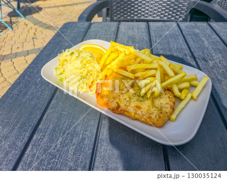 Cod with fries and sauerkraut. Cod with fries and sauerkraut. 130035124