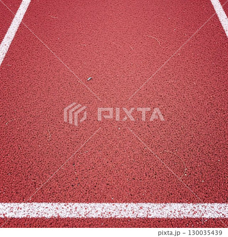 Red running track texture with white sports lane line detail. 130035439