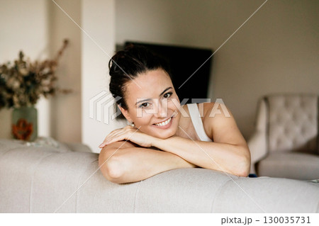 Confident woman taking a break, casual home portrait. Confident woman taking a break, casual home portrait. 130035731